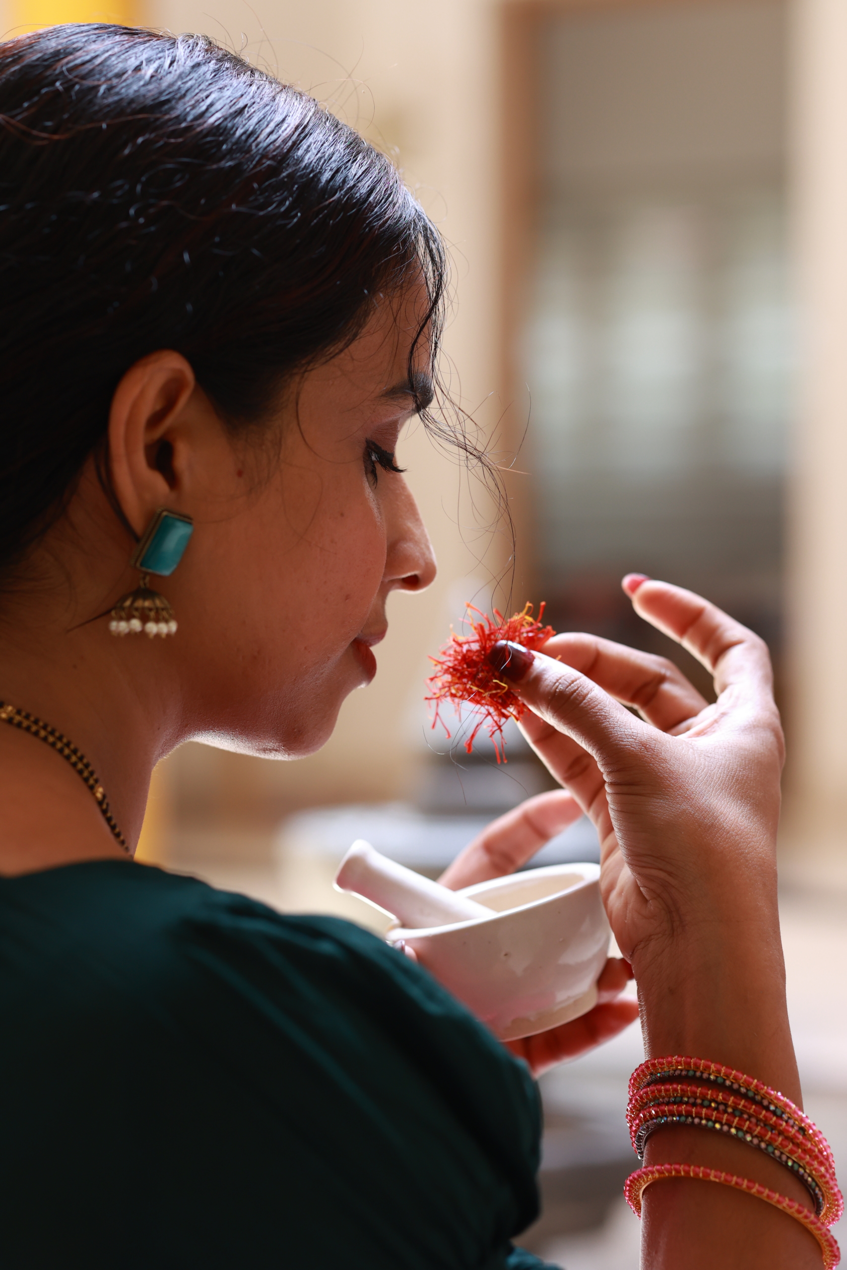 Sruthy working with herbal ingredients